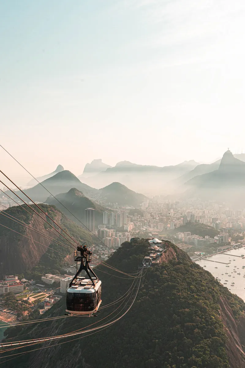 The Sugarloaf cable car gliding high above Rio in morning haze